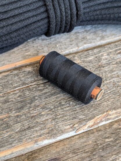 Sewing thread (154) as Charcoal